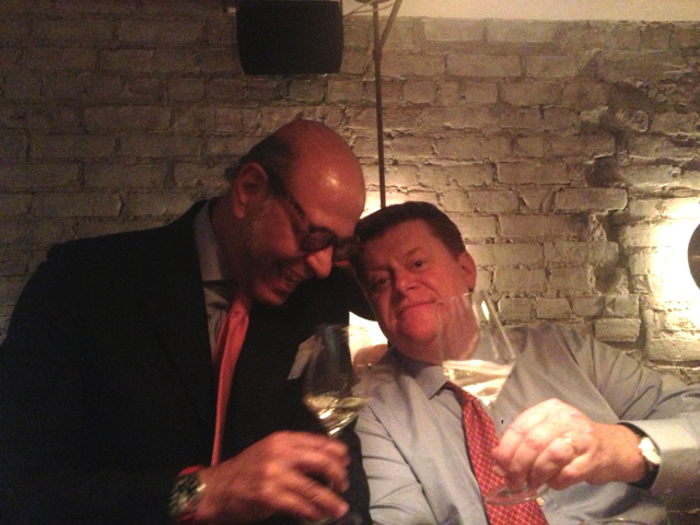 two men drinking wine